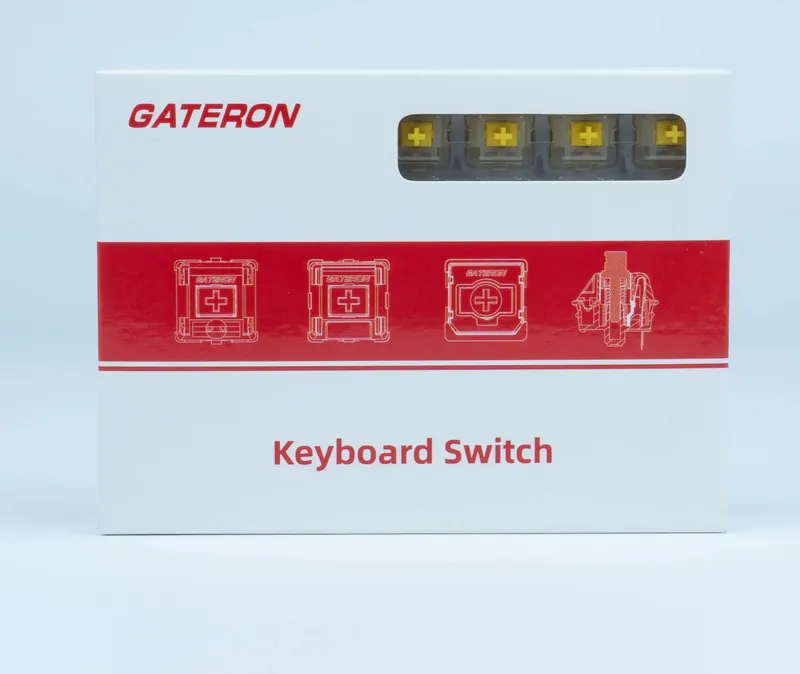 Hộp switch Gateron màu trắng viền đỏ, ô trong suốt phía trên thấy các switch stem vàng